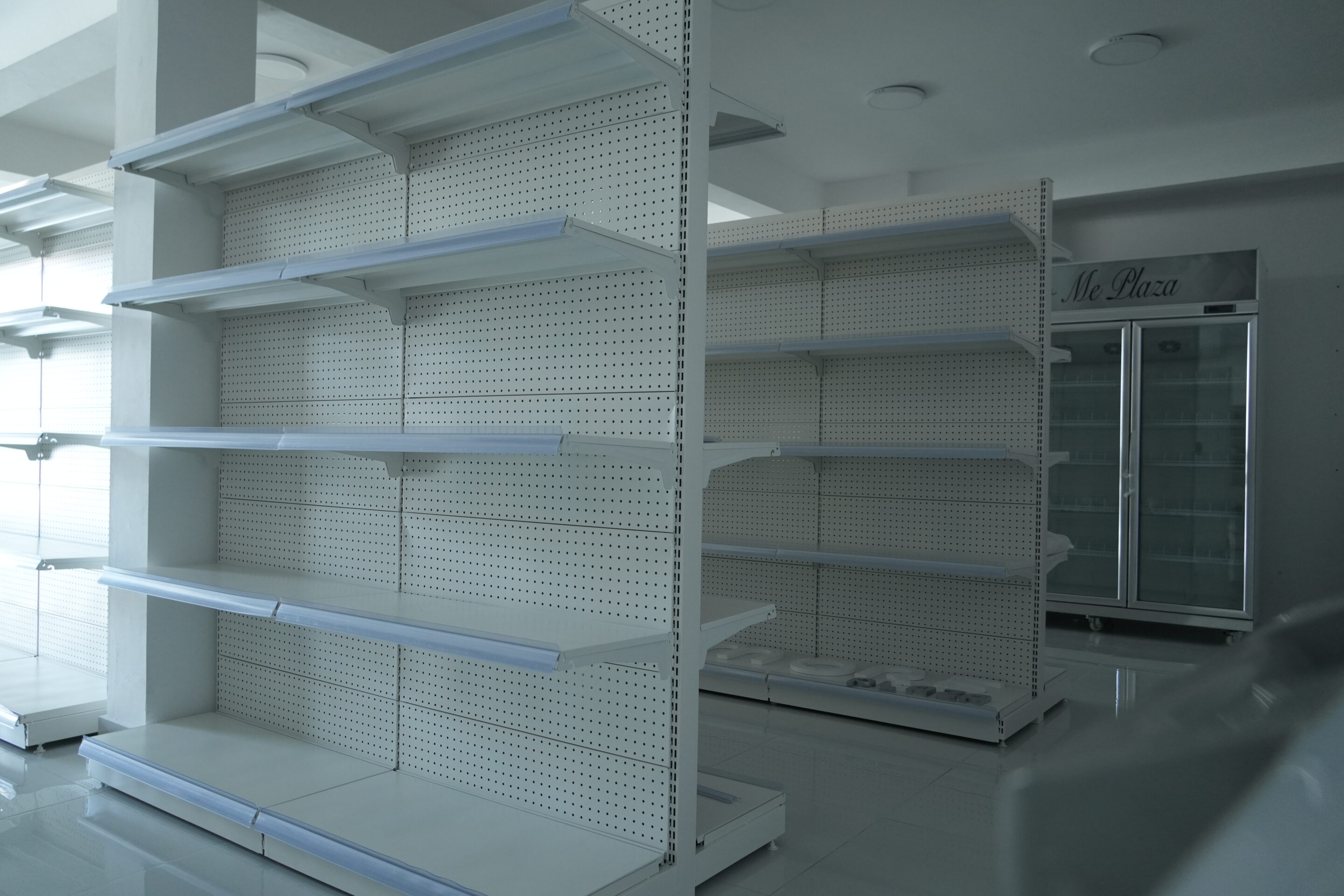 vecteezy empty white shelves in a retail store with a refrigerator in 75281030